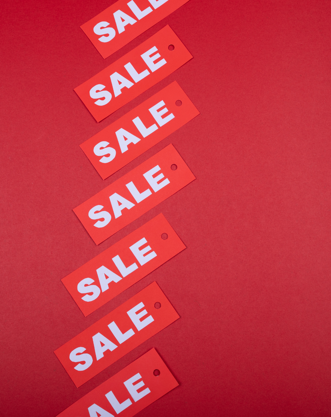 a collection of red sale tags on red background