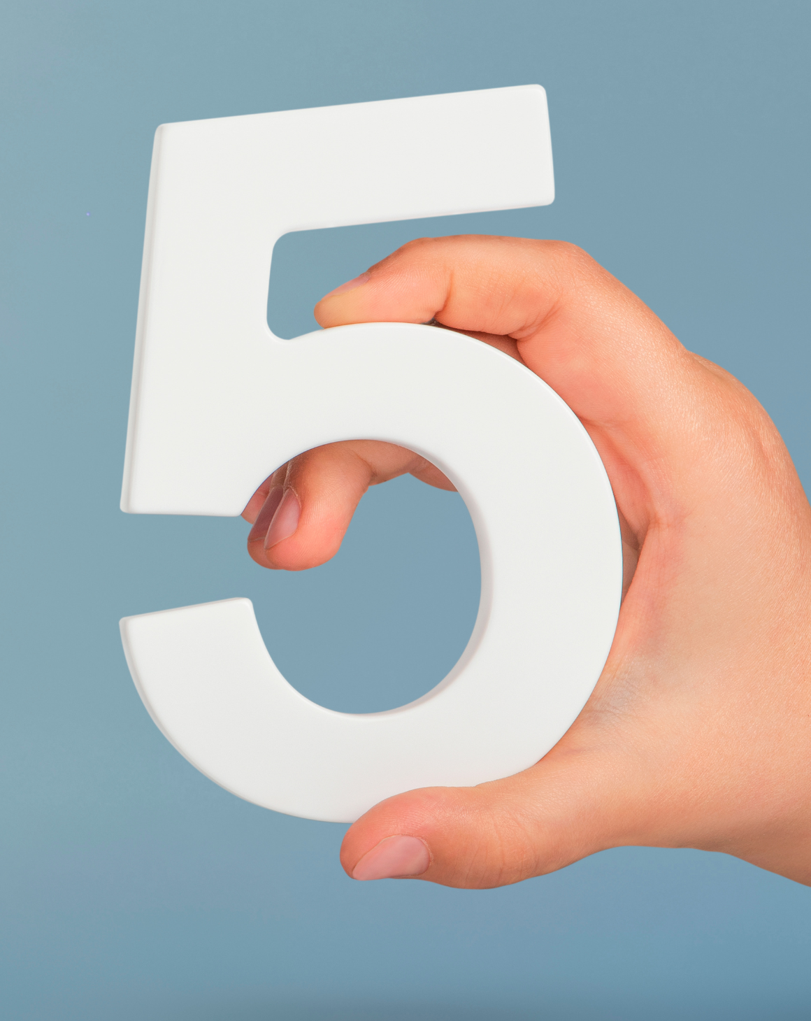 a person holding number five