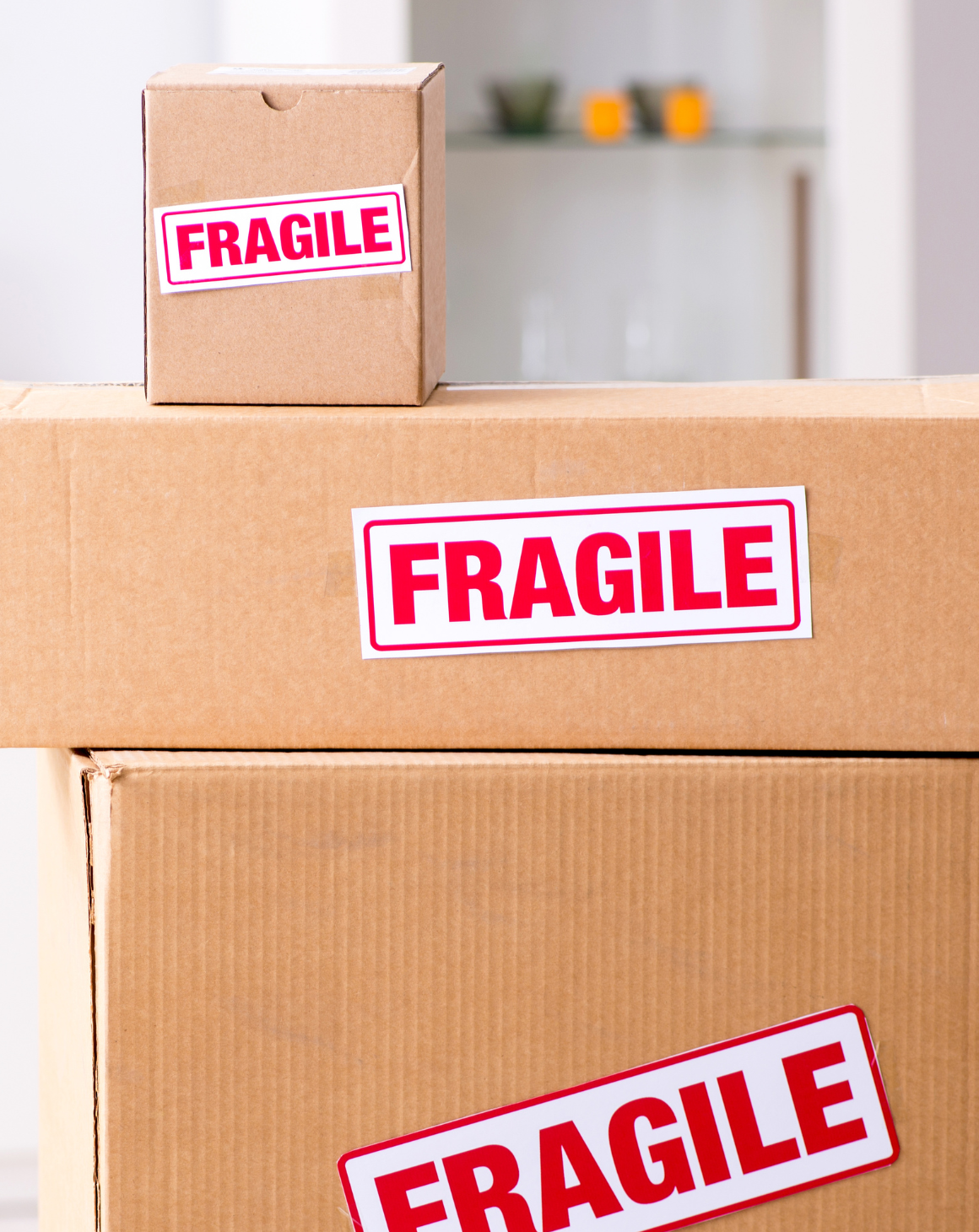 a set of cardboard boxes with word fragile on them