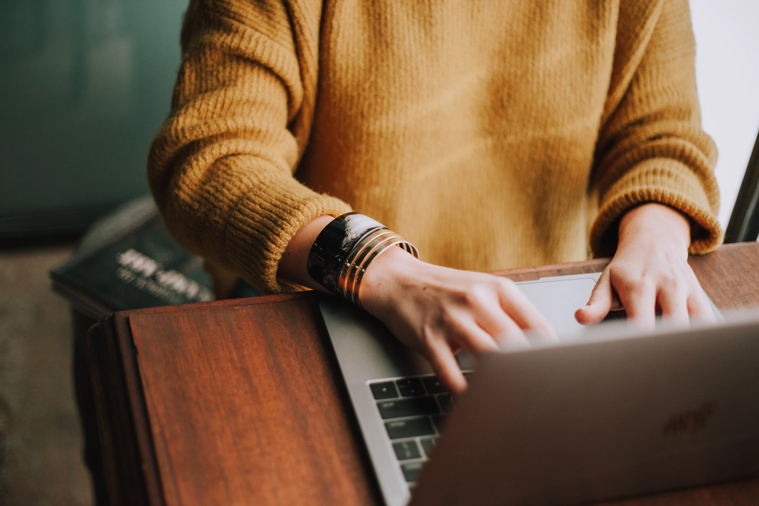 A woman working on a computer for an advertising agency 