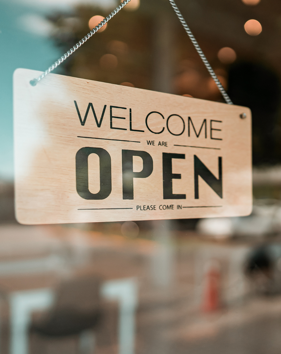 An open sign on a brand store door