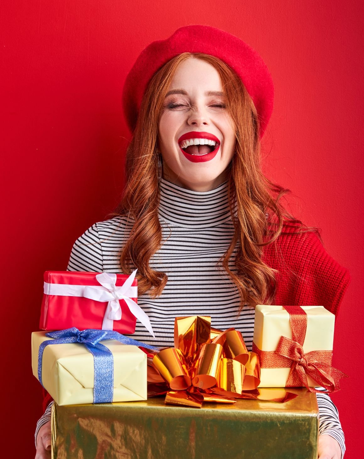 smiling woman holding gifts