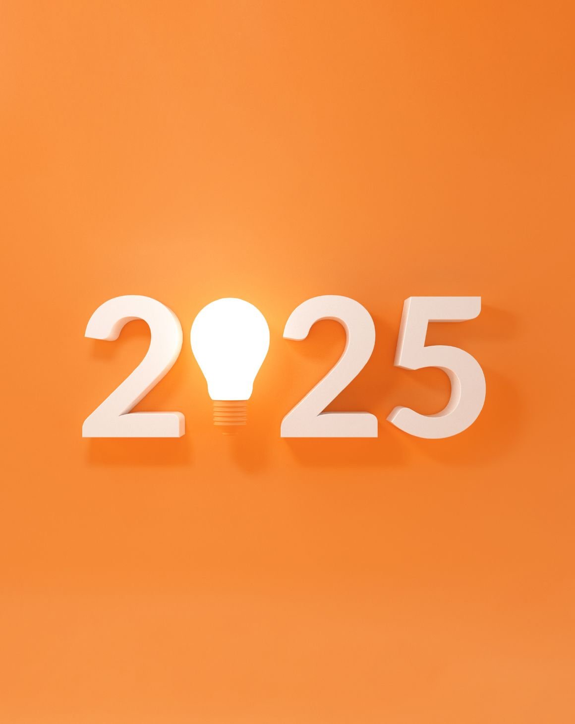 A bright light bulb on an orange backdrop for 2025 eCommerce trends