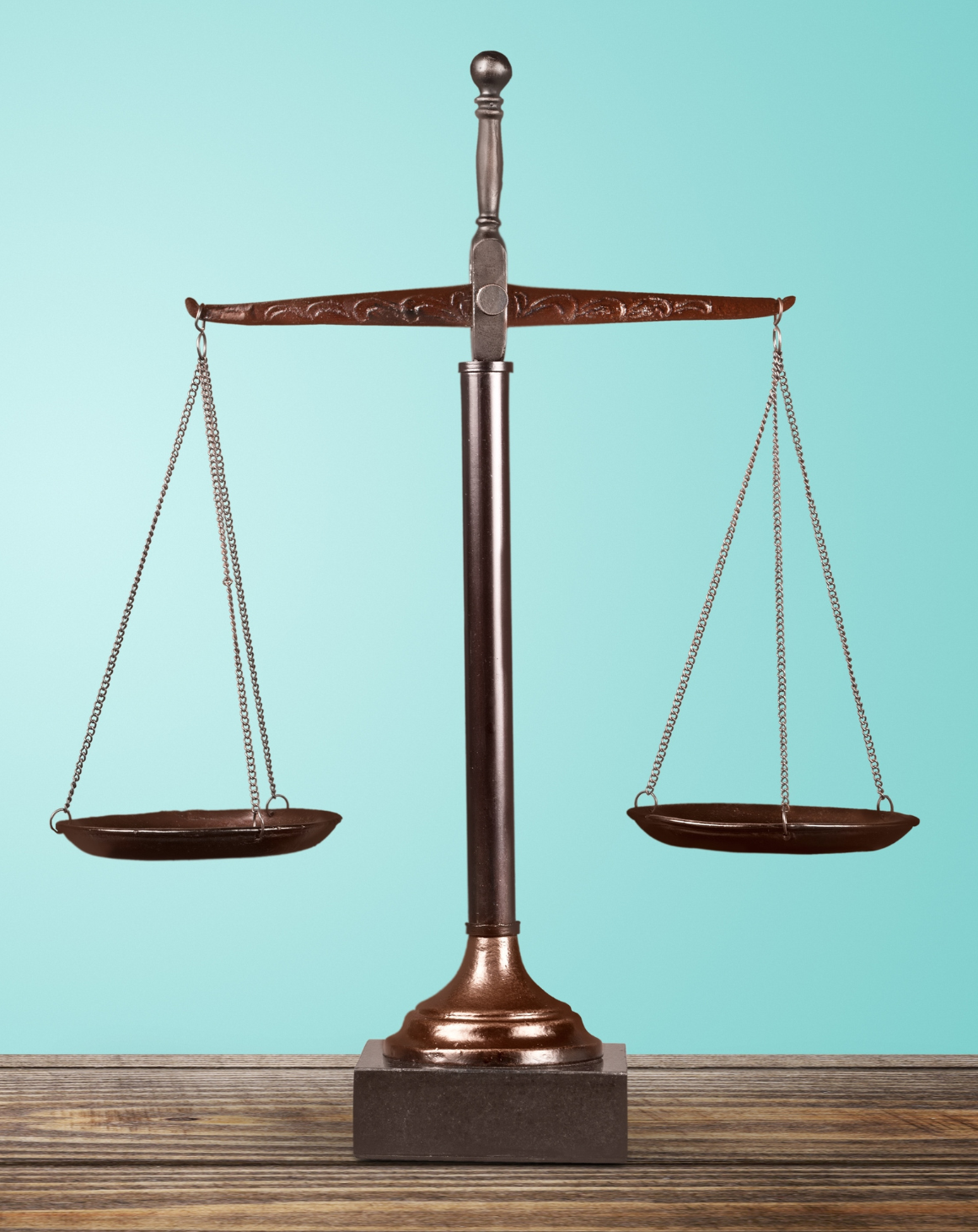 A justice scale standing on a desk