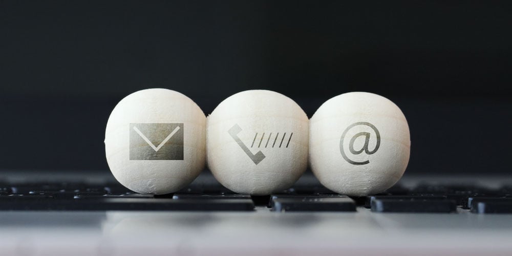 A set of white wooden balls with information signs