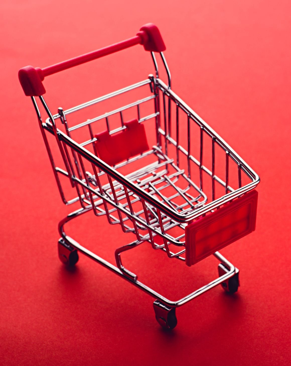 A shopping cart on a red background 