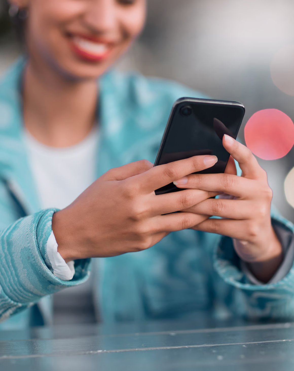 A girl using a mobile phone to scroll on social media for Amazon products