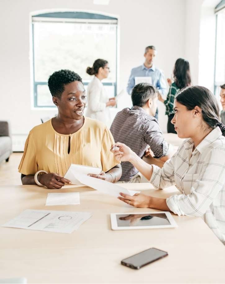 two-people-strategizing-in-the-workplace