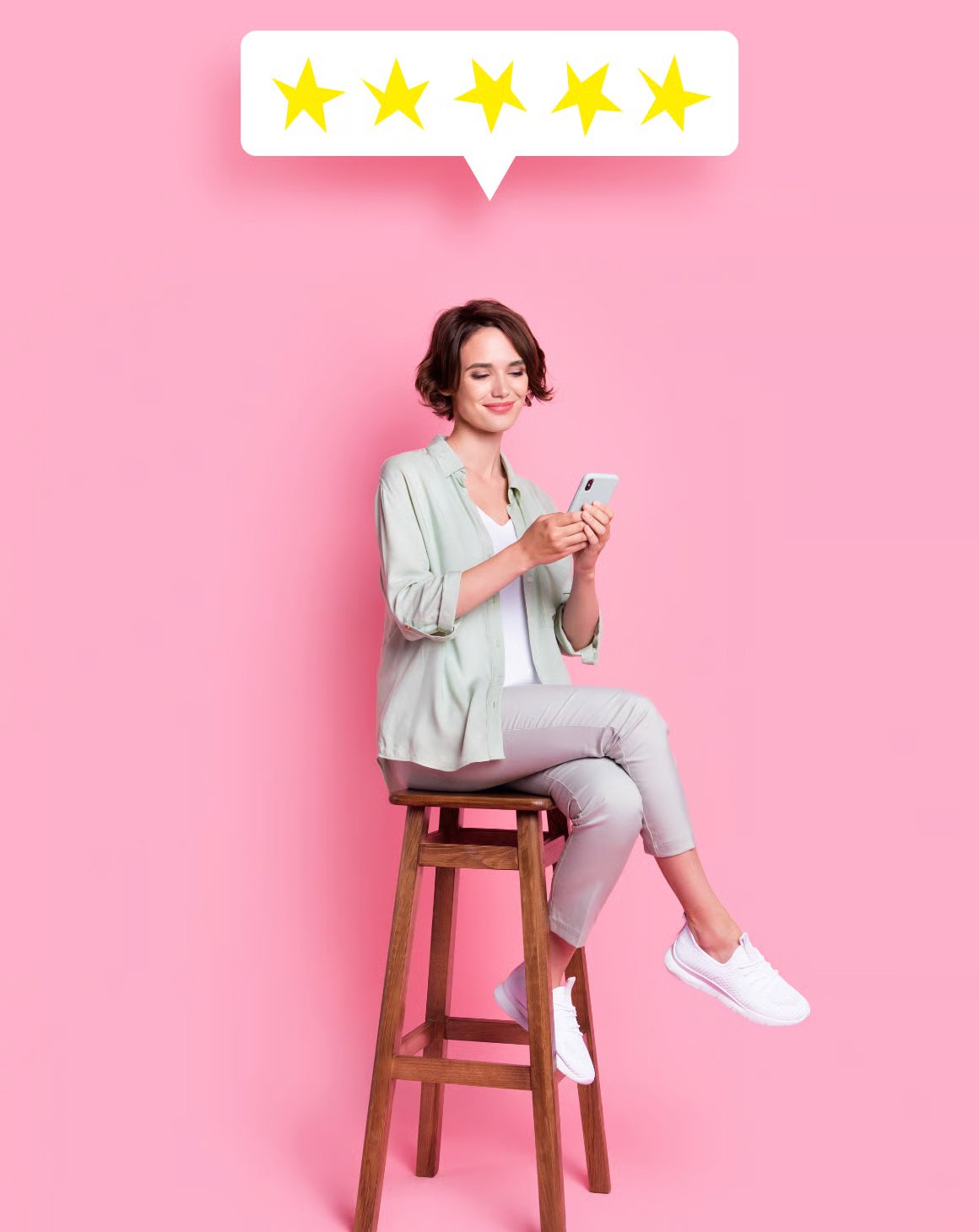 smiling woman sitting stool leaving a product review